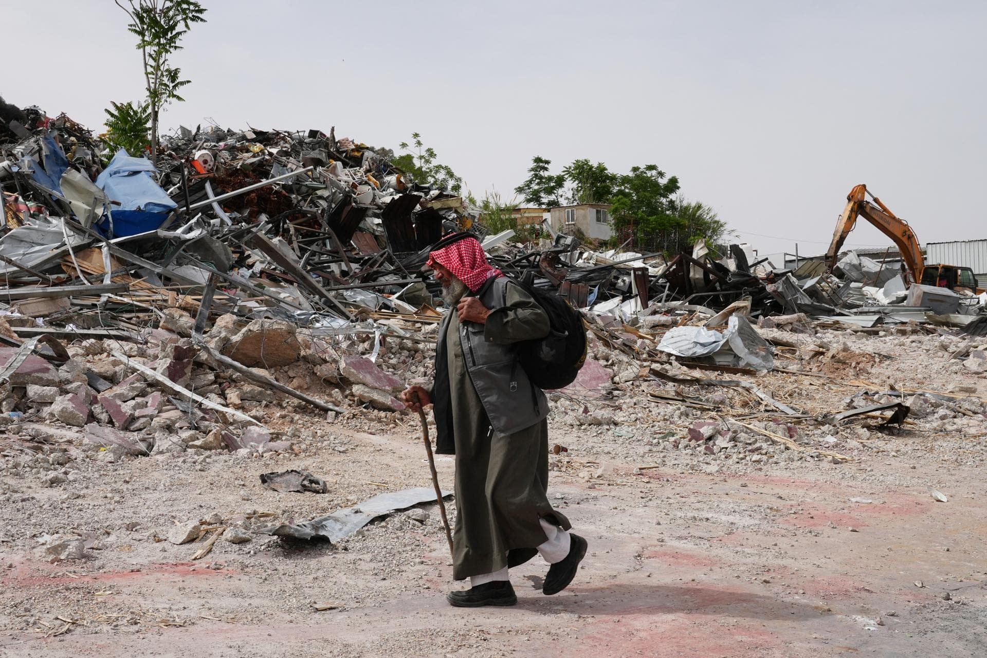 Israeli bulldozers raze about 50 Palestinian shops ahead of settlement-linked road project